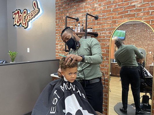 Crafting impeccable style for the next generation at No Grease! Premium Barbershop.