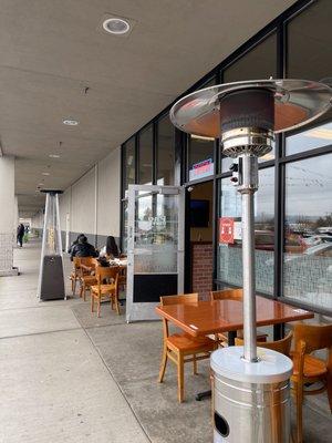 Outdoor dining.  Nice heaters and real tables and covered area, much better than a tent.