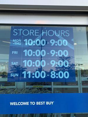 Best Buy store hours posted at the front door