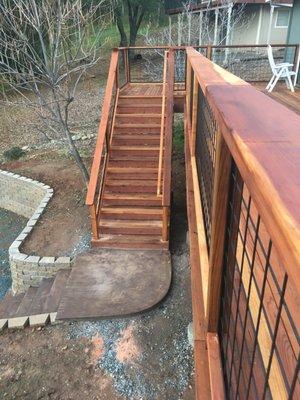 Redwood stairs and a curved retaining wall