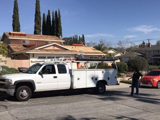 Replacing a roof with all new sheeting and minor wood repair to the eaves.