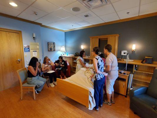 Members of our church singing at AdentHealth Hospice for George Mathis and his wife June.