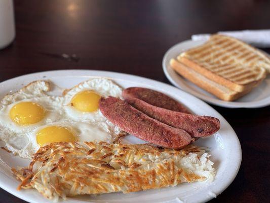 Reindeer Sausages w/ 3 eggs, hash potatoes, and sourdough toast