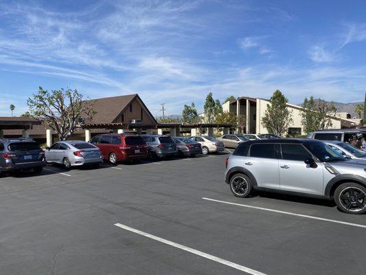 Looking northwest, showing part of the spacious church parking lot, with plenty of parking spaces for guests!