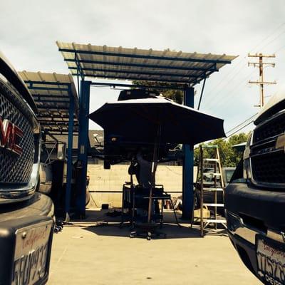 Wrenchin' on a car.