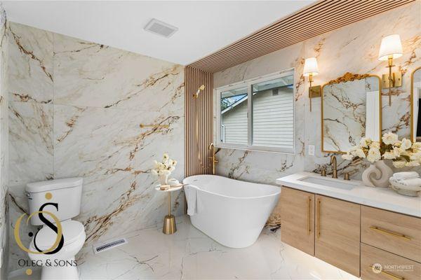 Elevate your bathroom with a luxurious freestanding tub and marble tile installation from Oleg & Sons Home Remodeling in Redmond, WA. Our ex