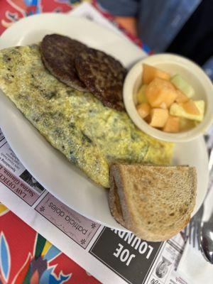 Garden omelette  with sausage patties and fruit