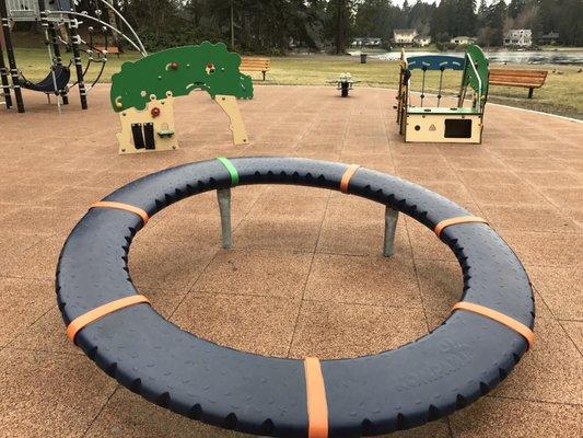 New playground with the modern merry go round or whatever this odd thing is that my kids love to spin!