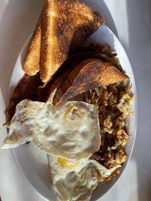 Eggs bacon toast and hashbrowns