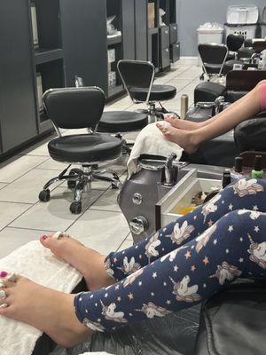 My girls enjoying the massage chairs after their pedicures were done.