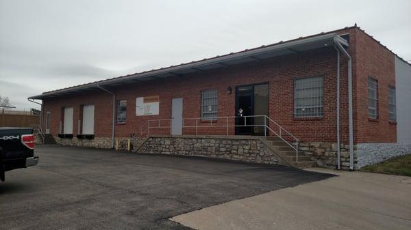 This is the face of our building, with the office door and truck loading dock.  We have a drive in entrance on the north end of the building