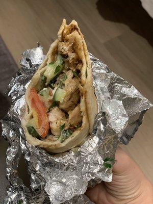 Half-eaten chicken shawarma. Sorry for not cute pic - it wasn't cut in half.