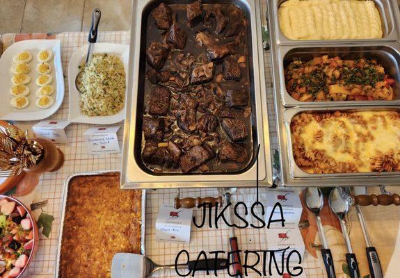 Short rib, baked fusilli pasta, mashed potatoes, devil's egg, fruit salad, couscous salad, roasted vegetables