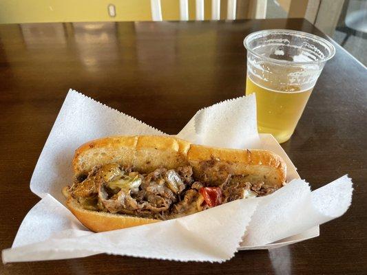 Mushroom cheesesteak with sweet peppers and a Backstreet Mex Lager