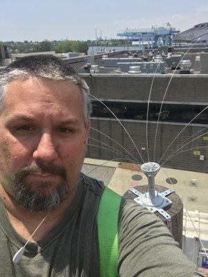 Installing Bird Spiders on Telephone poles for Seagull Exclusion Next to a Large Sanitation Facility