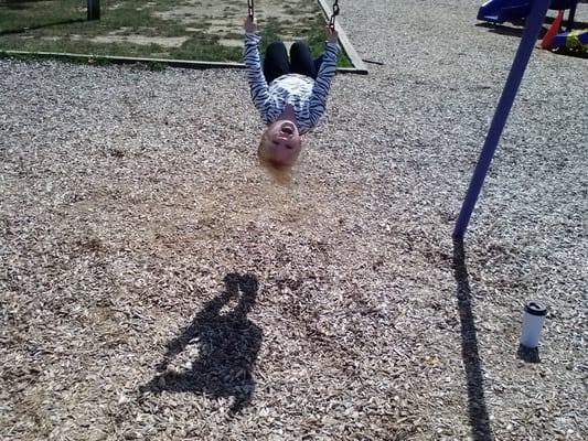 She always enjoys the swings.