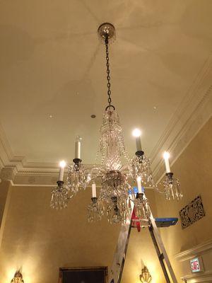 Chandelier cleaning in a hotel