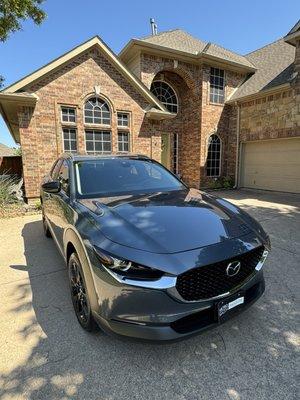 The car in my parents driveway waiting for my military transfer across country to collect it!