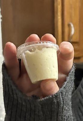 A Ketchup container of icecream with the $15 lava cake