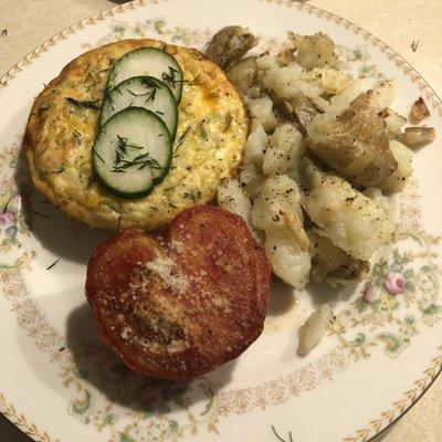 Healthy crust-less, veggie quiche with broiled, parmesan-herbed tomato.