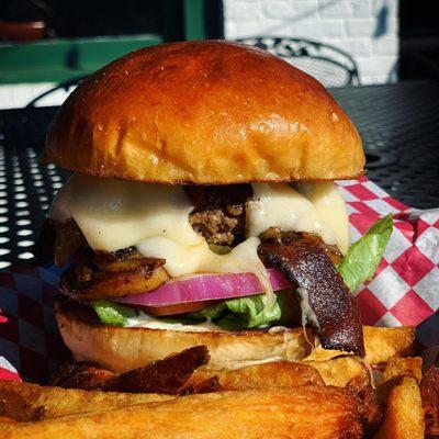 clubhouse burger with bacon - certified angus beef patty, swiss cheese, butter sauteed mushrooms and caramelized onions.