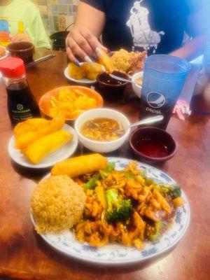 Me and my daughter enjoying this yummy goodness Hunan chicken.