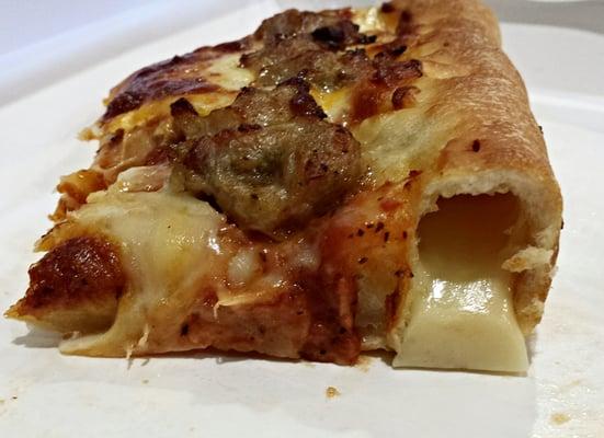 If you seek a semi-melted cheese stick awash in the taste of liquid smoke, then Rocky's has just the pizza for you.