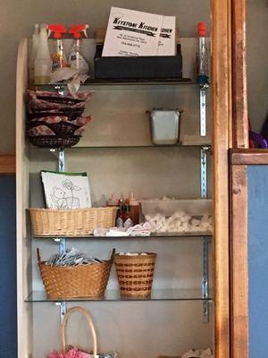 Cleaning products above premade chip baskets & cleaning rag actually hanging in the chips below.