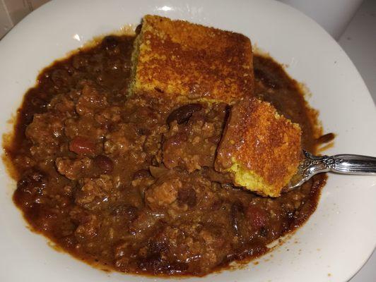 Homemade from scratch slow-simmered well-seasoned chili Daily LUNCH SPECIAL of the Day with corn bread