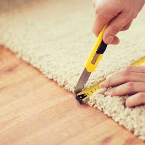 Carpet stretching with a power stretching tool