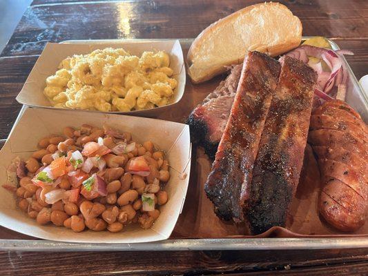 Texas Trinity; Brisket, Ribs, jalapeno cheddar sausage, brisket beans and Mac n' cheese