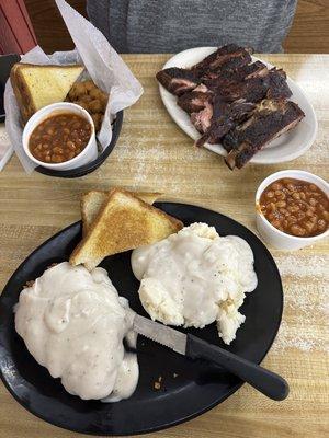 Fried okra, Texas toast, baked beans and ribs and on bottom the chicken fried chicken dinner