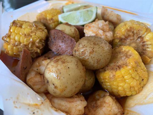 Mariscade (Shrimp, Corn, Potatoes and Sausage) in a spicy broth