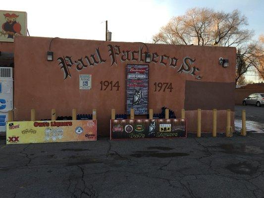 The side of Owl Liquors, with a tribute to Paul Pacheco Sr. Photo taken by my wife.