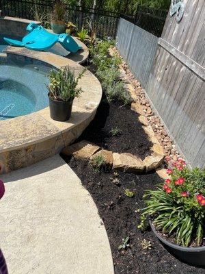 Behind pool planting beds