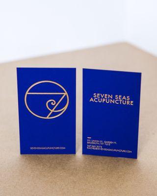 Gold Foil business cards on a double thick blue paper stock.