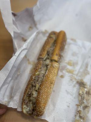 Cheesesteak with cooper and onions on house baked seeded roll