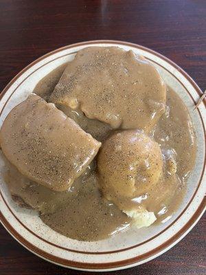 Whole hot beef sandwich with mashed potatoes.