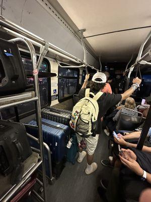 He kept telling people to get in and away from their luggage so he could stuff more people in