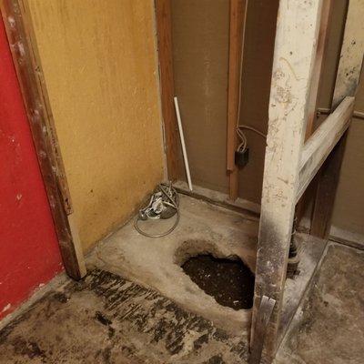 Hole where plumbing was for shower. Now open season for spiders and other creepy crawlers to come in!