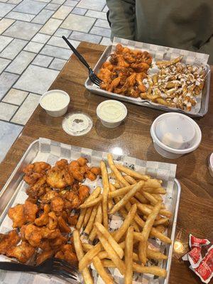 Cauliflower wings, seasoned fries, and Regular Pretzel Bites