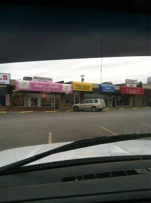 Parking lot shot of store front.