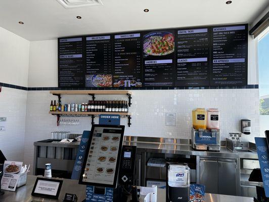 Self-ordering kiosk with staff on standby