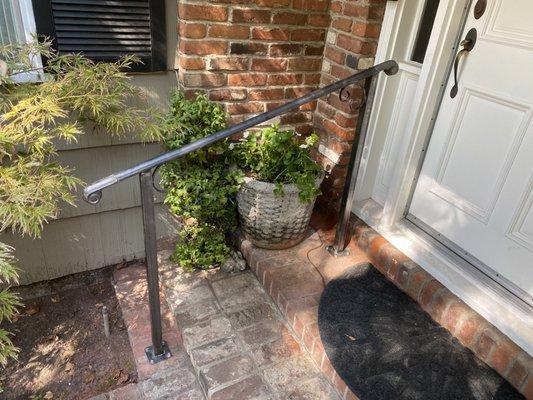 Front door step hand rail