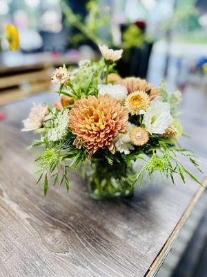 Pretty muted Fall flower arrangement filled with tan mums, peach ranunculus, white roses...ready to make someone's birthday extra special