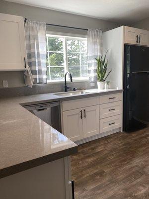 Our new kitchen with quartz counters, lifeproof floors, white cabinents