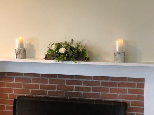 Flowers for a mantle in the reception venue.