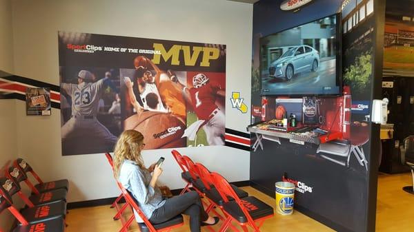 Even you're girlfriend can watch ESPN while you get a haircut!