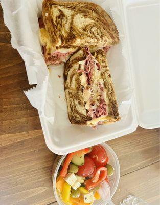 Reuben sandwich and Greek Salad