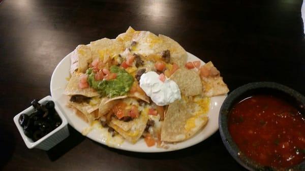 FULL order Nachos with steak. No beans. It feels like "Where's Waldo?" With the steak. Ok, your turn...find Waldo!